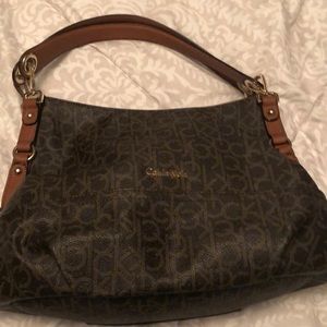 Calvin Klein. Dark and light brown.